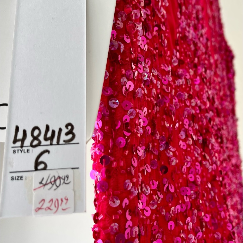 Long formal cap sleeve fuchsia sequence gown
